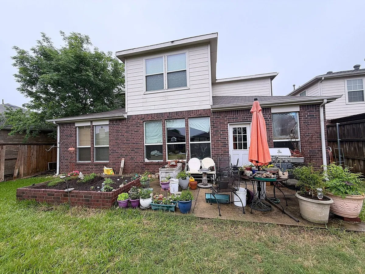 Rear elevation of the Wylie home before the work