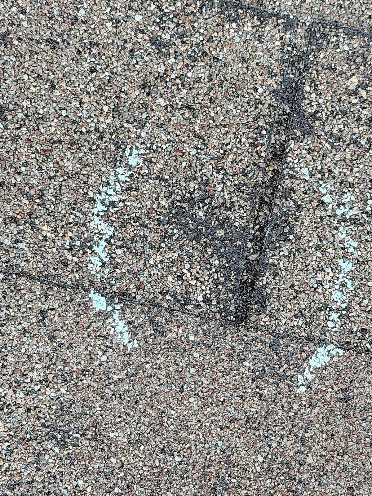 Chalked hail damage on the existing shingles