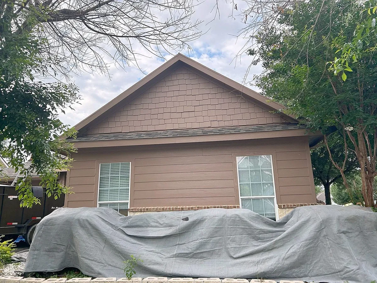 Rear of the house with a cover over the patio furniture