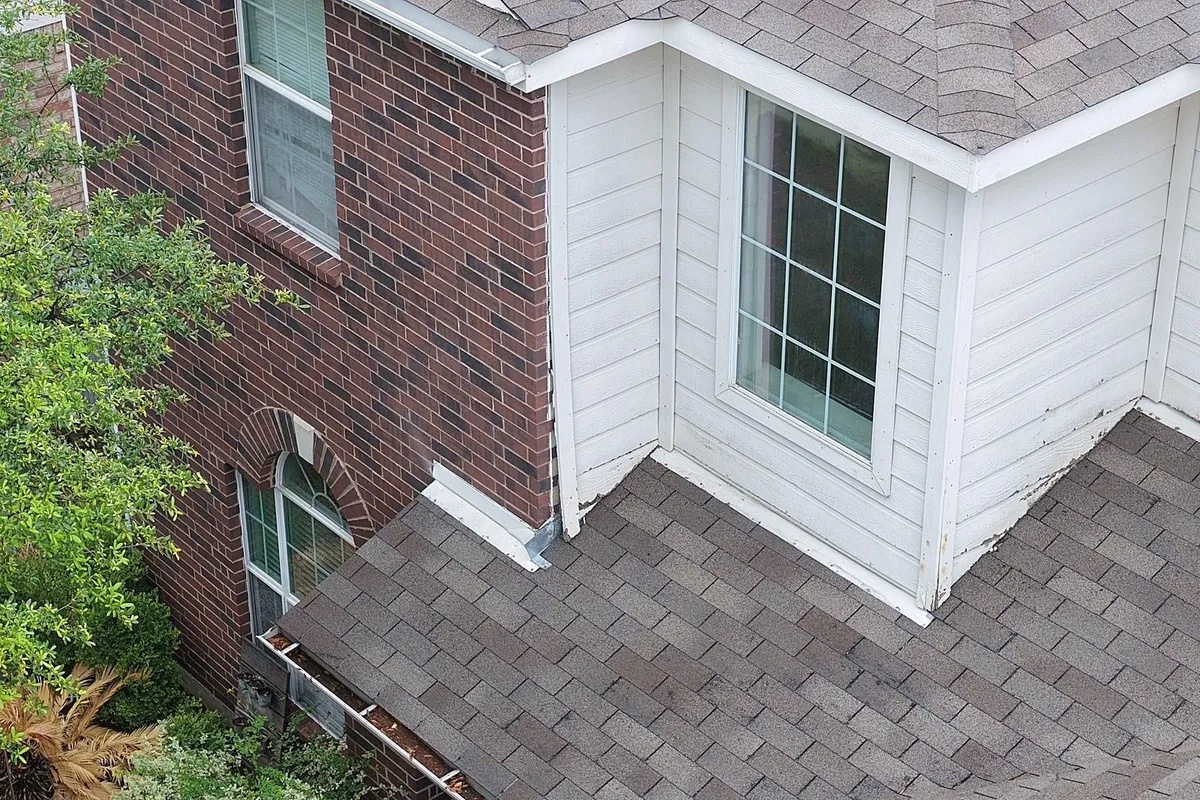 New shingles finished at the corner of the house