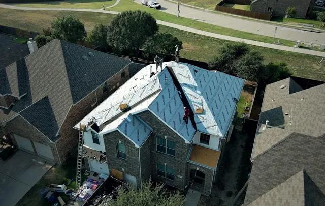 Peoples Construction crew mid-reroof on a North Texas home