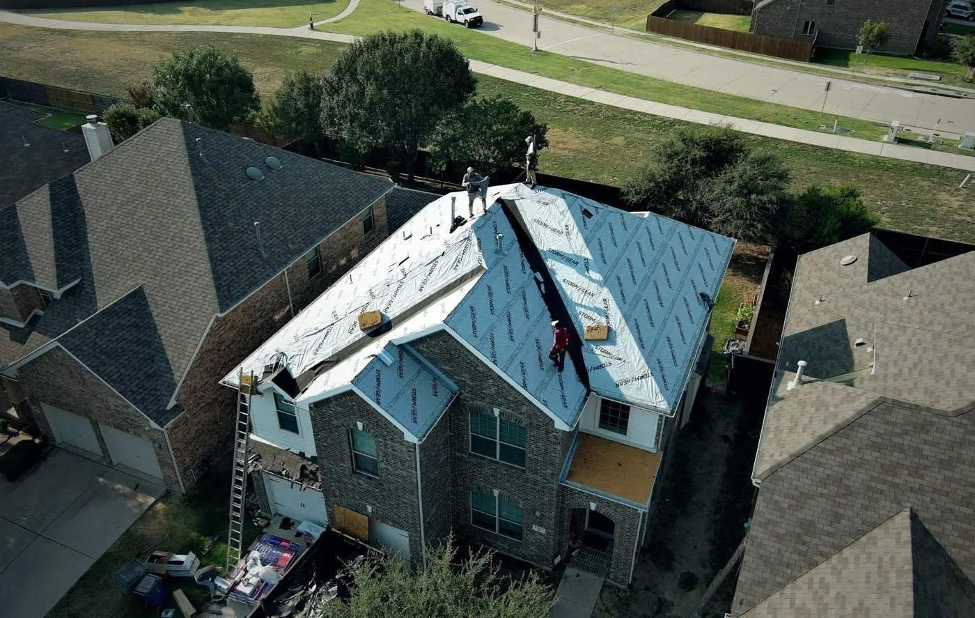 Completed residential roof replacement on a two-story home