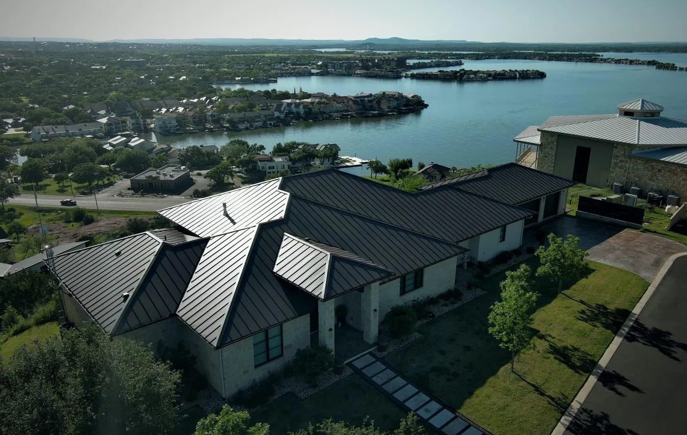 Finished standing-seam metal roof on a lakeside home